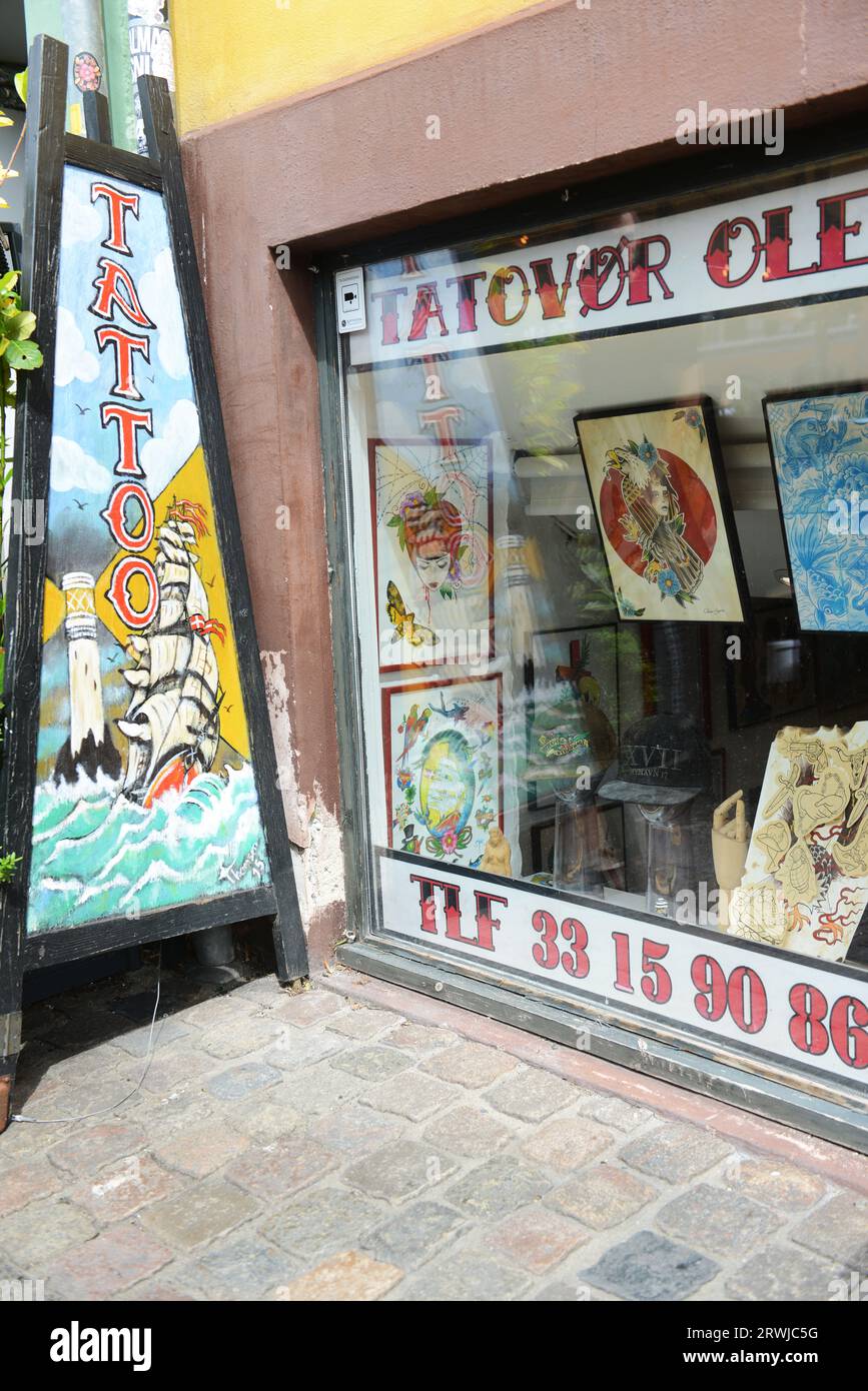 Tattoo Ole is the world's oldest still functioning tattoo shop. Nyhavn 17, Copenhagen, Denmark. Stock Photo