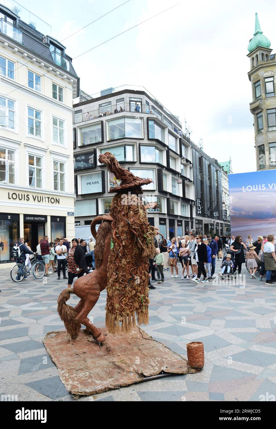 Levitating man illusion entertainer at  the Amagertorv pedestrian street in Copenhagen, Denmark. Stock Photo