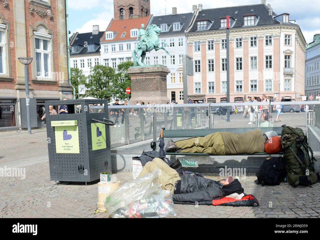 Homeless people sleeping by the Gammel Strand subway station in Copenhagen, Denmark. Stock Photo