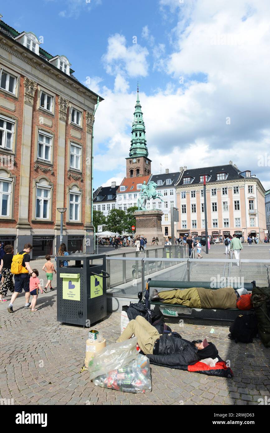 Homeless people sleeping by the Gammel Strand subway station in