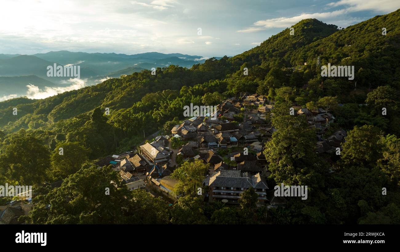 Pu'er. 18th Sep, 2023. This aerial photo taken on Sept. 18, 2023 shows the Wengji Village at sunset in Pu'er City, southwest China's Yunnan Province. The Cultural Landscape of Old Tea Forests of Jingmai Mountain in Pu'er was inscribed on the UNESCO World Heritage List on Sunday at the extended 45th session of the UNESCO World Heritage Committee in Riyadh, Saudi Arabia, making it China's 57th World Heritage Site. Credit: Hu Chao/Xinhua/Alamy Live News Stock Photo
