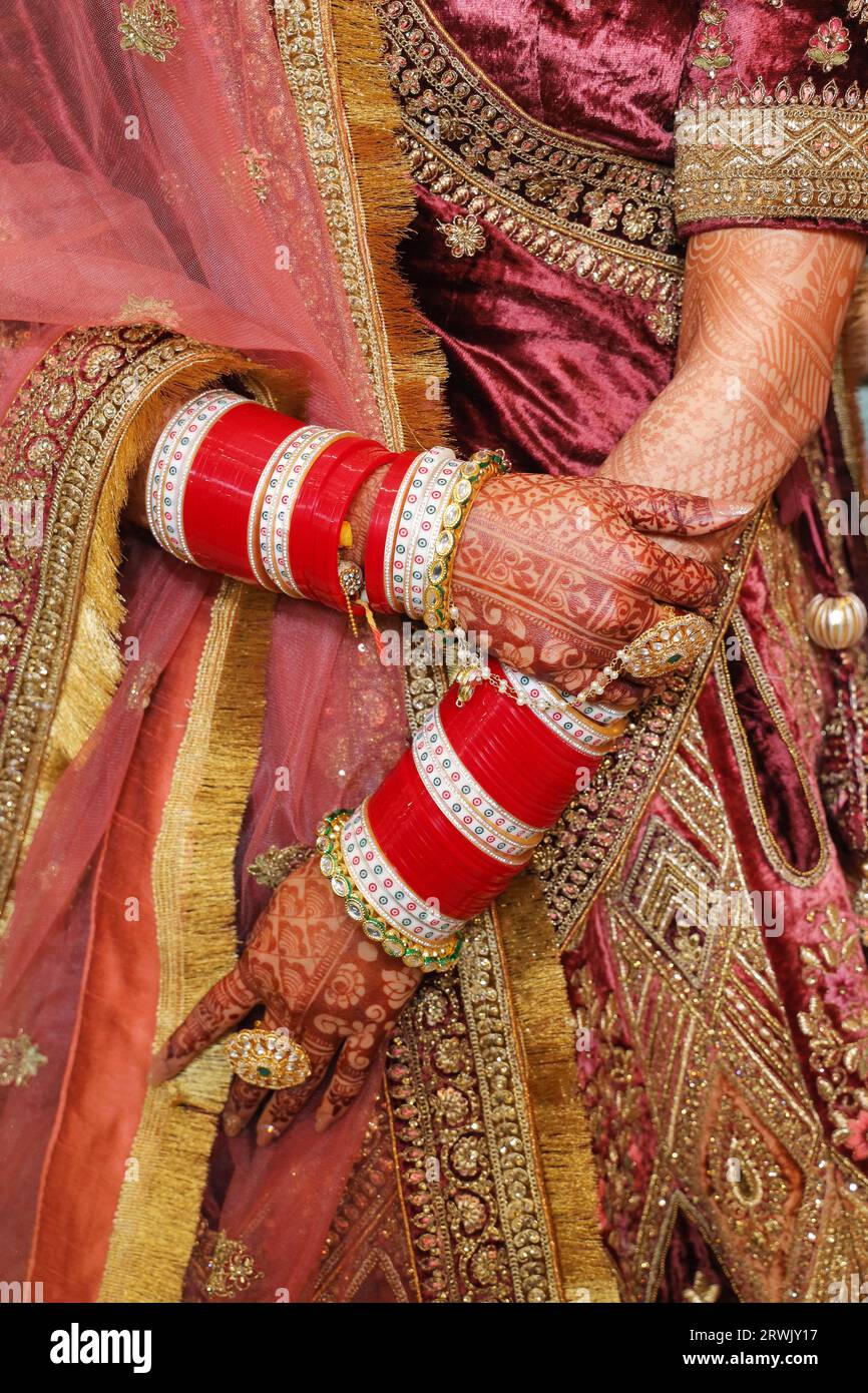 Closeup of hand of indian bride wearing beautiful bangles Stock Photo