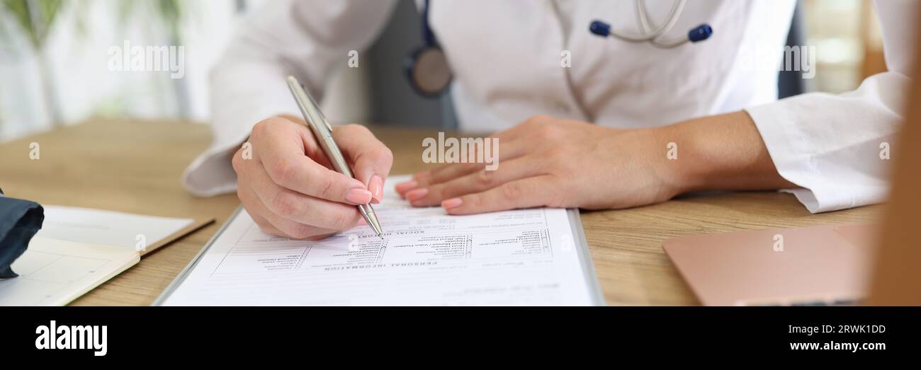 Doctor working with medical documents in clinic Stock Photo - Alamy