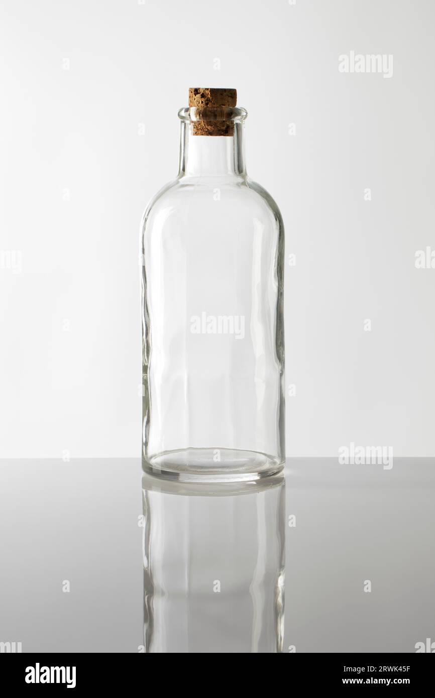 An old fashioned glass bottle with cork stopper Stock Photo