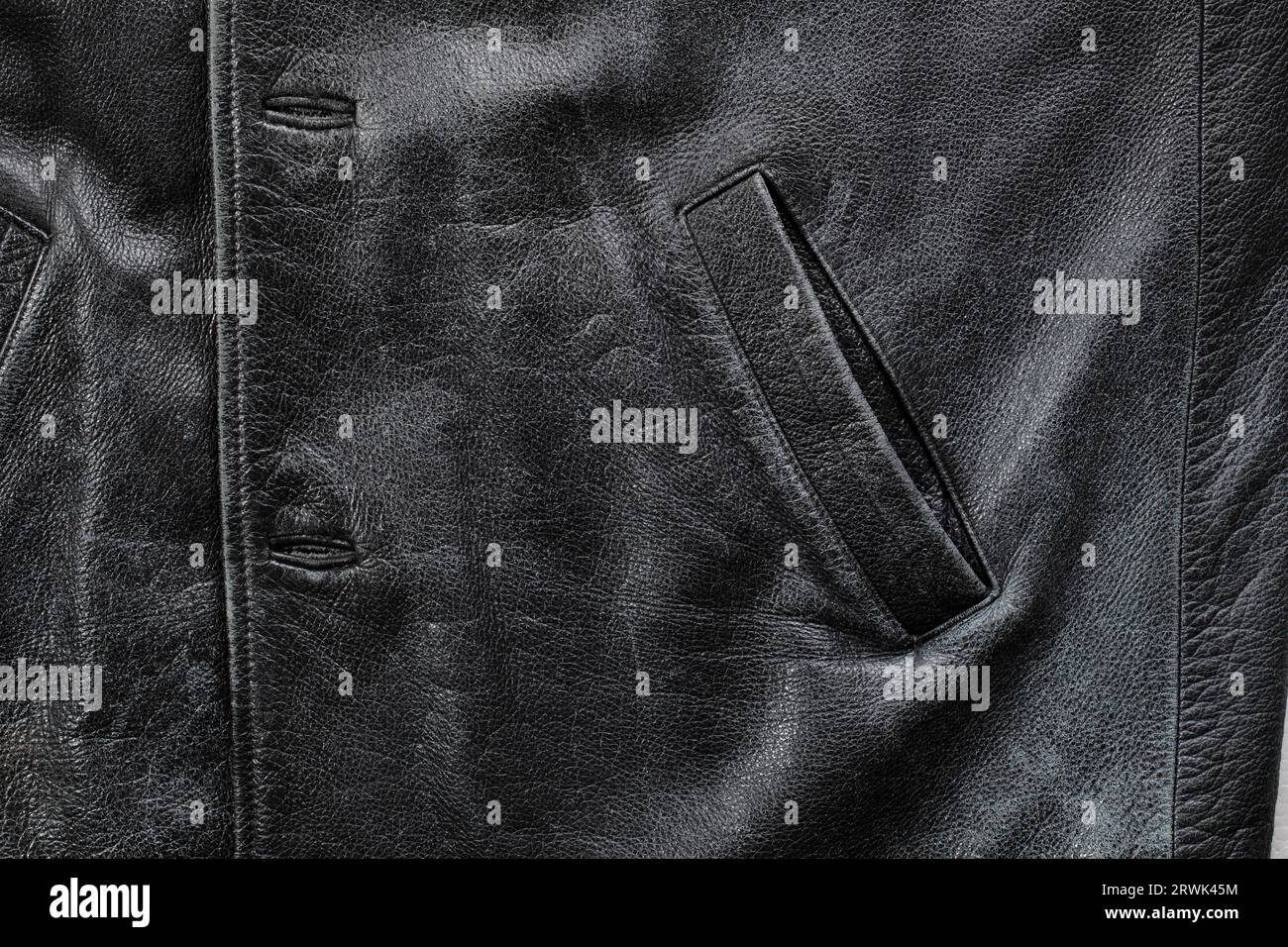 Pocket detail of an old black worn leather jacket Stock Photo