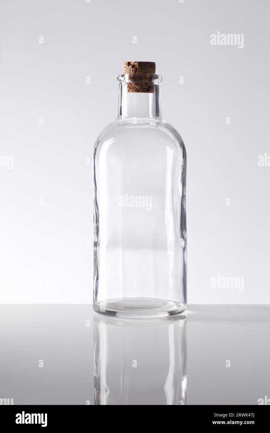 Old fashioned glass bottle with a cork stopper Stock Photo