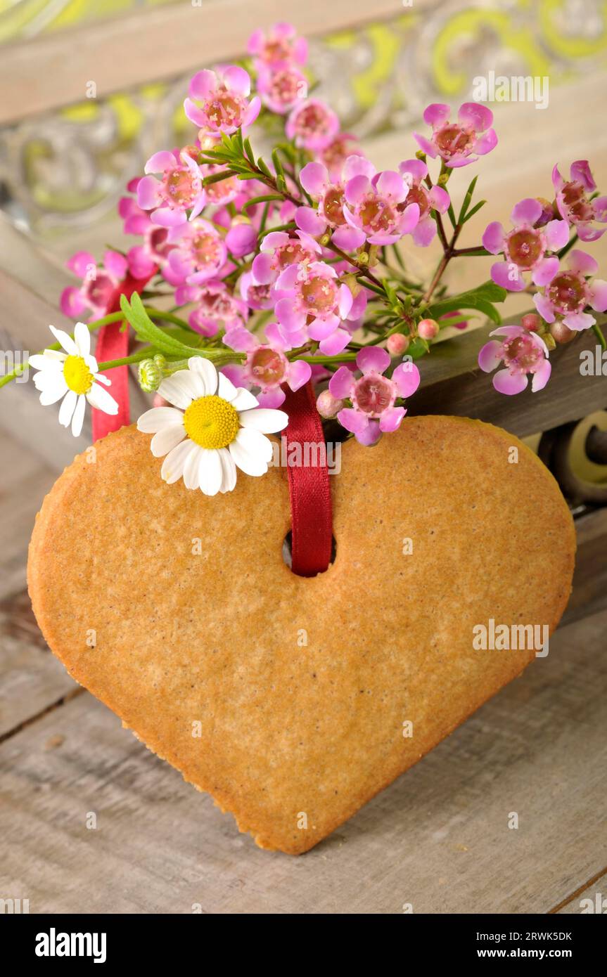 Baked Heart Decorated with Country Style Flowers Stock Photo