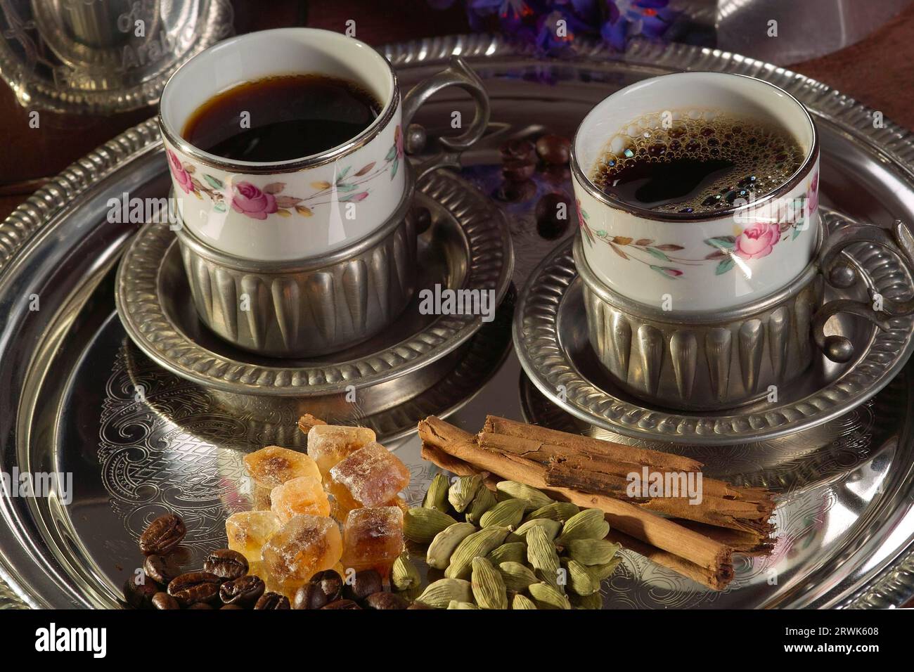 Arabic coffee in demitasse cups on silver tray with spices Stock Photo