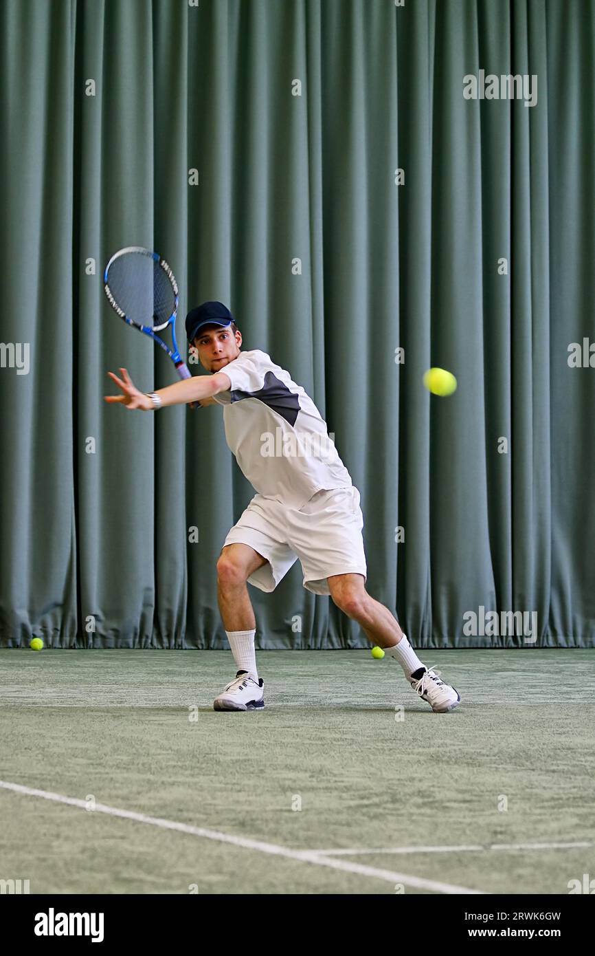 Tennis player hits forehand Stock Photo Alamy