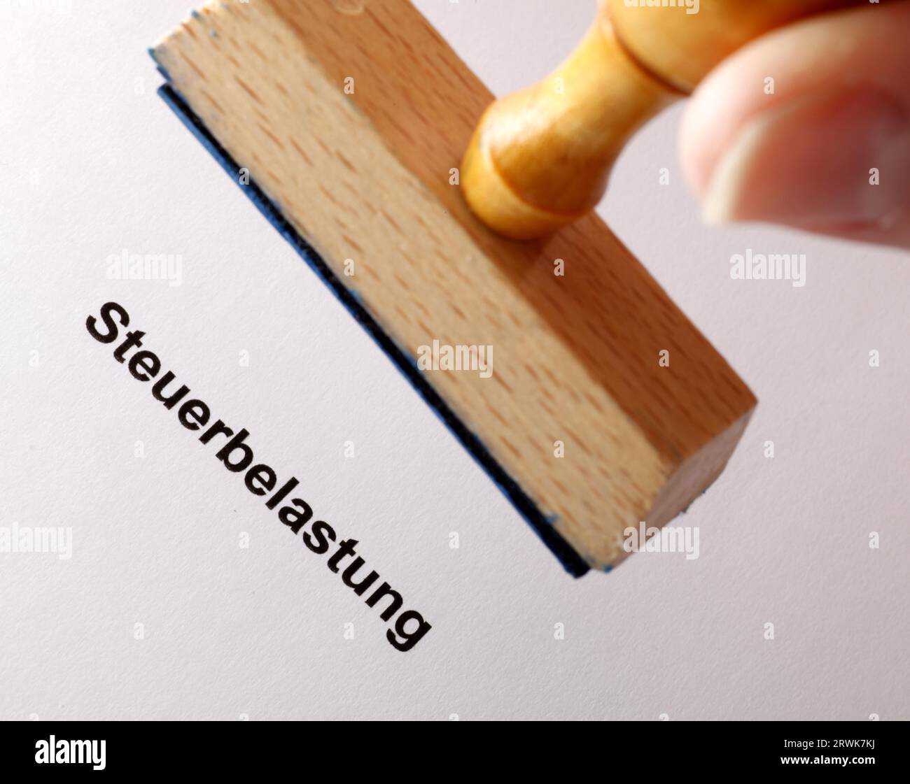 Stamp text Tax burden Stock Photo
