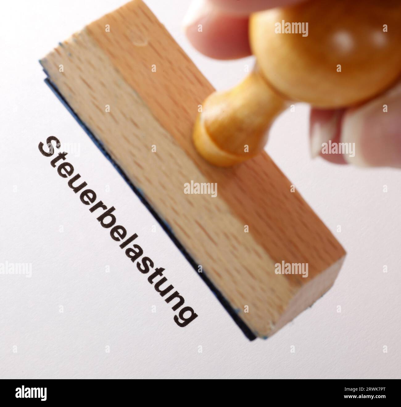 Stamp text Tax burden Stock Photo