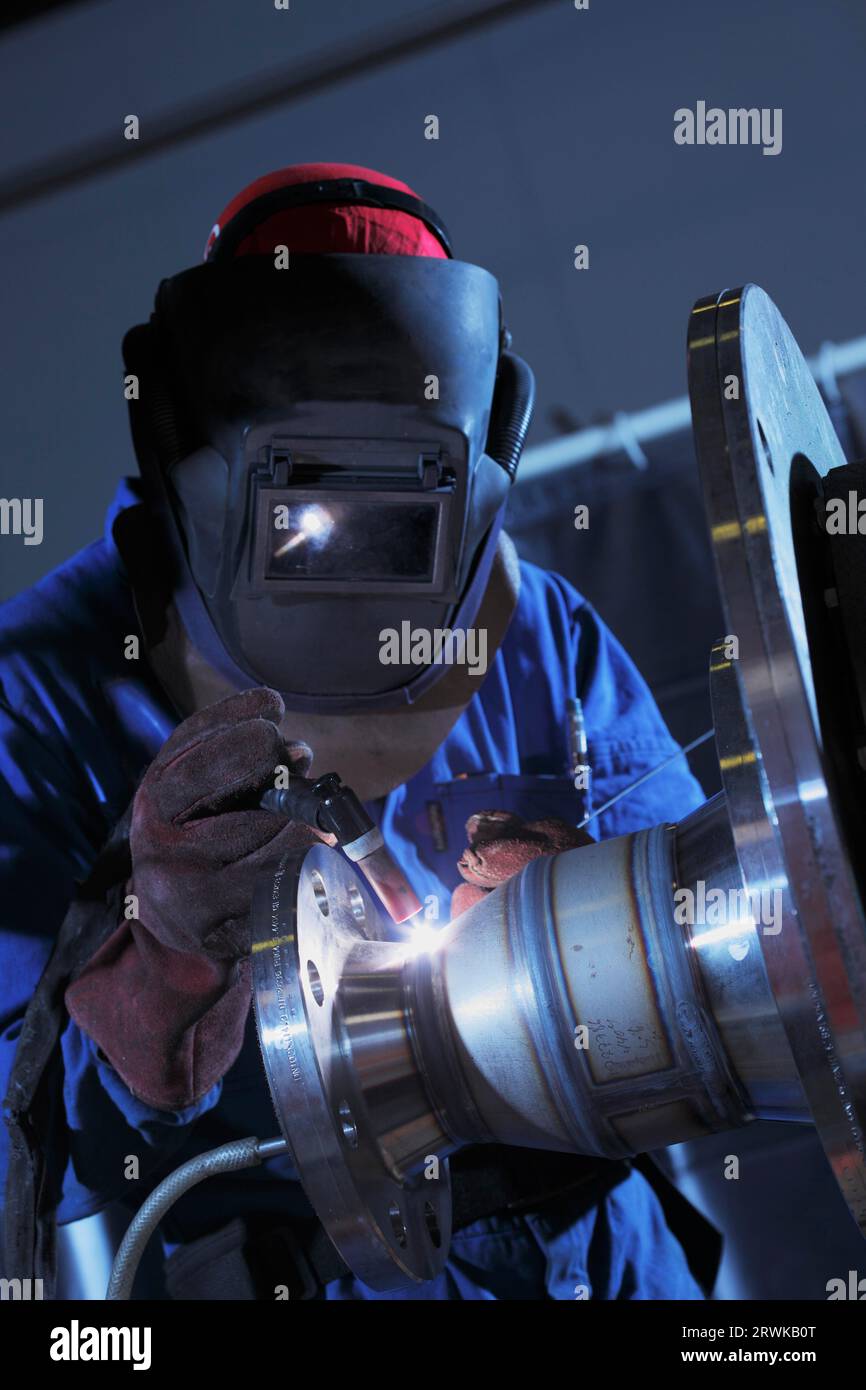 Industrial welder at work welding stainless steel with G weld Stock