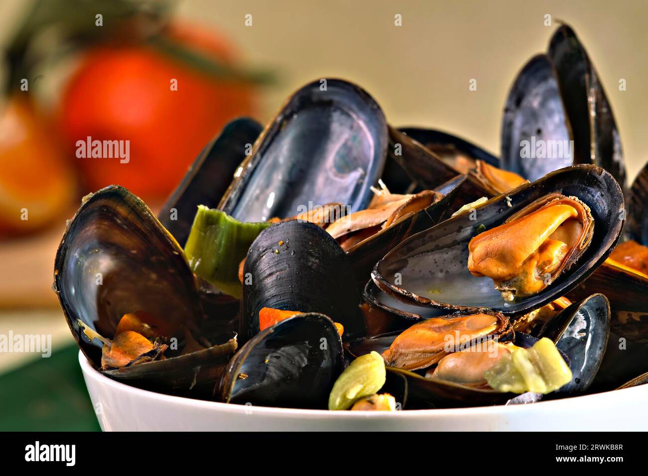 Cooked mussels in white wine broth Stock Photo Alamy