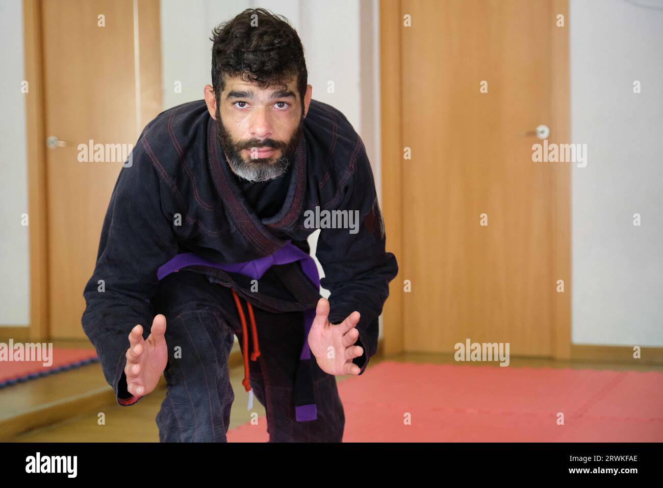 Brazilian JiuJitsu teacher at the Academy looking at camera. BJJ