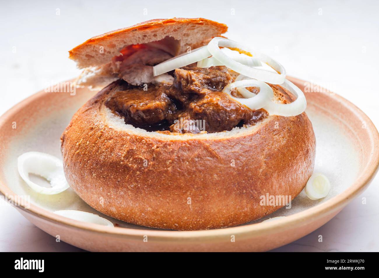 beef goulash in loaf of bread Stock Photo
