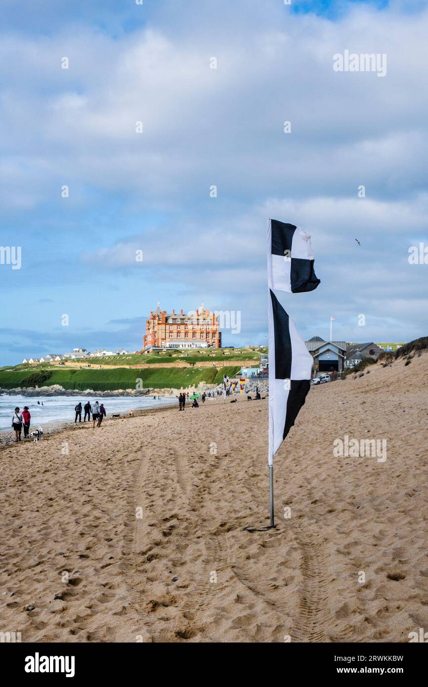 A black and white chequered beach flag indicating the area zoned by