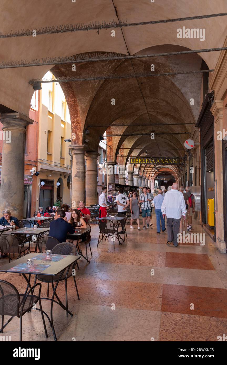 Libreria Nanni Bookshop and a restaurant on Via de' Musei, covered with a long high-ceiling porticos or colonnades with a roof structure over a walkway Stock Photo