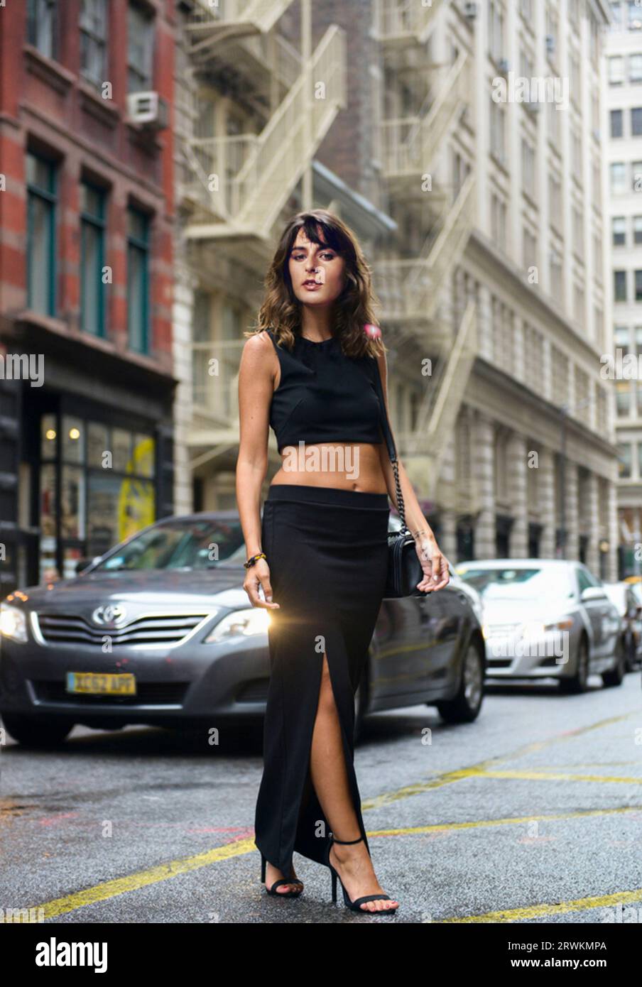 Elegant And Glamorous Brunette Young Woman Wearing A Black Crop top And Elegant and glamorous brunette young woman wearing a black crop top and