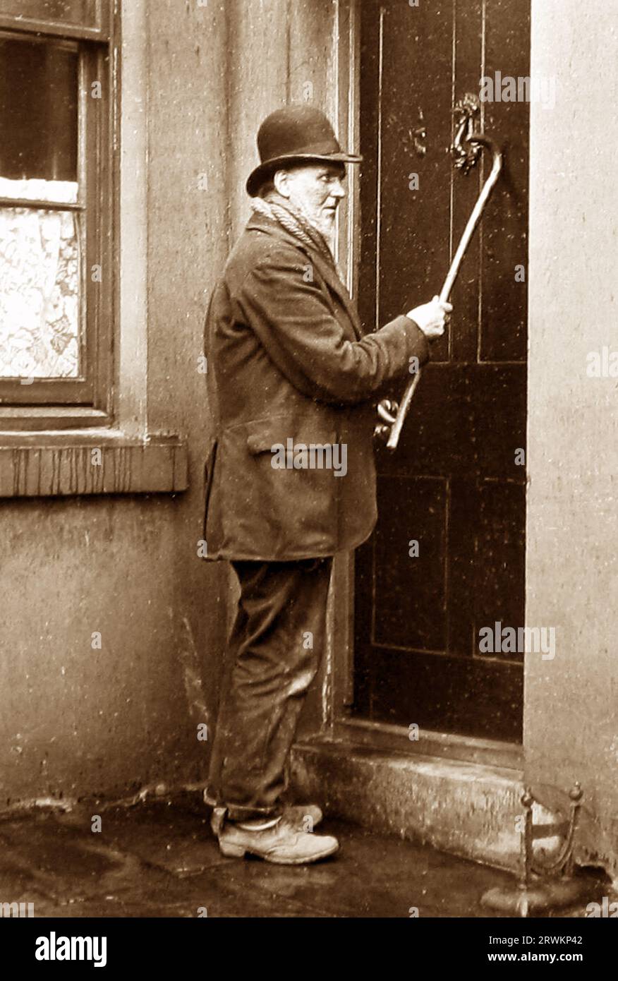 Knocker up, Victorian period Stock Photo Alamy