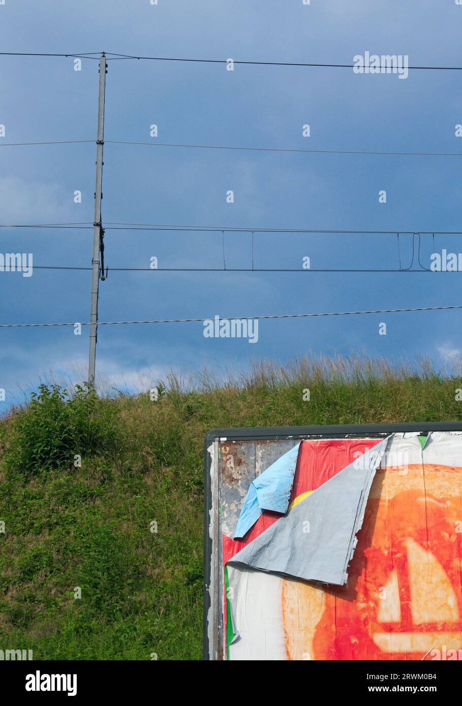 tattered layers of posters on billboard Stock Photo