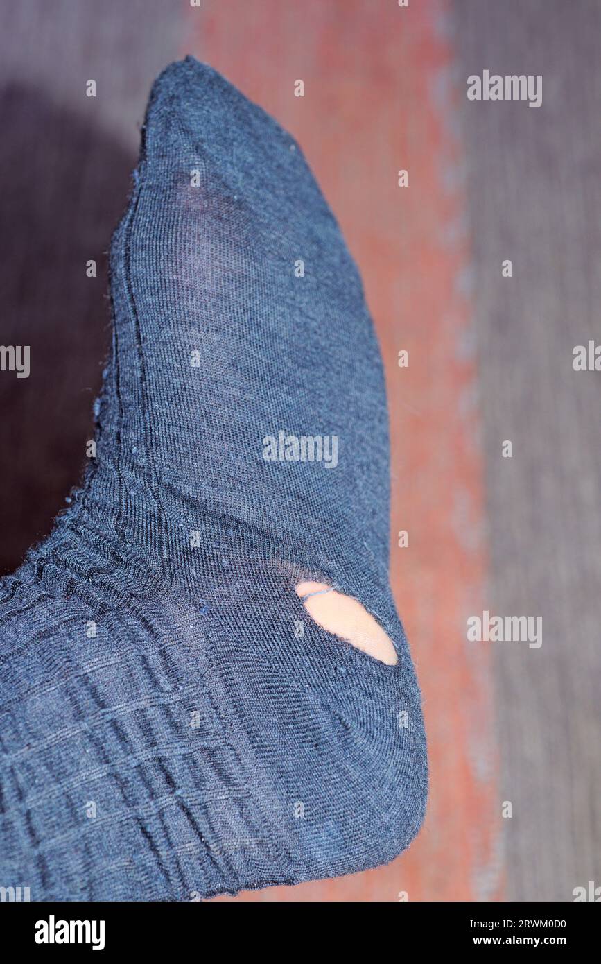 hole in sock Stock Photo - Alamy