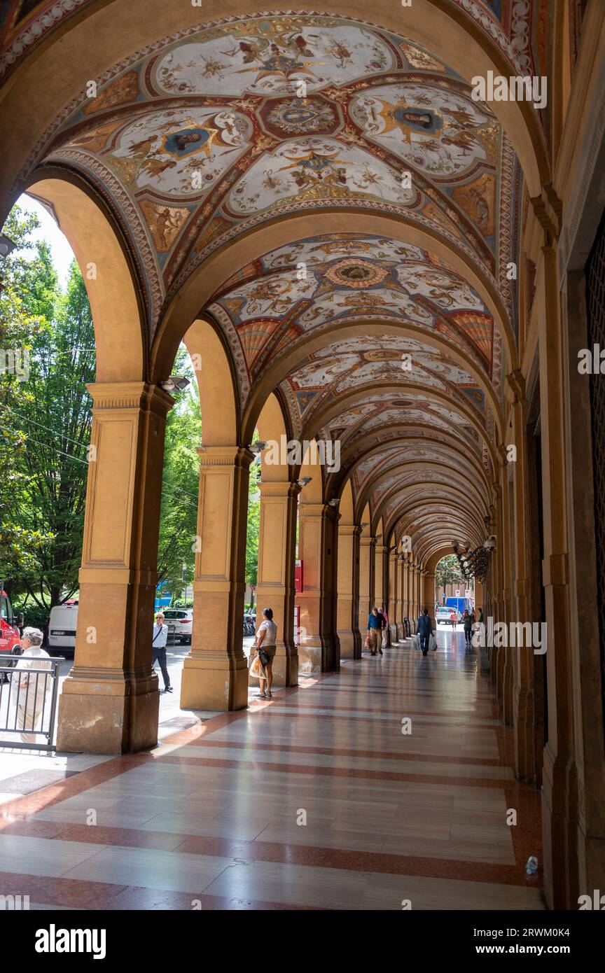 High above the ceilings of the Portici di Piazza Cavour e on Via Farini, are painted frescos, a type of mural painting that incorporates earth pigment Stock Photo