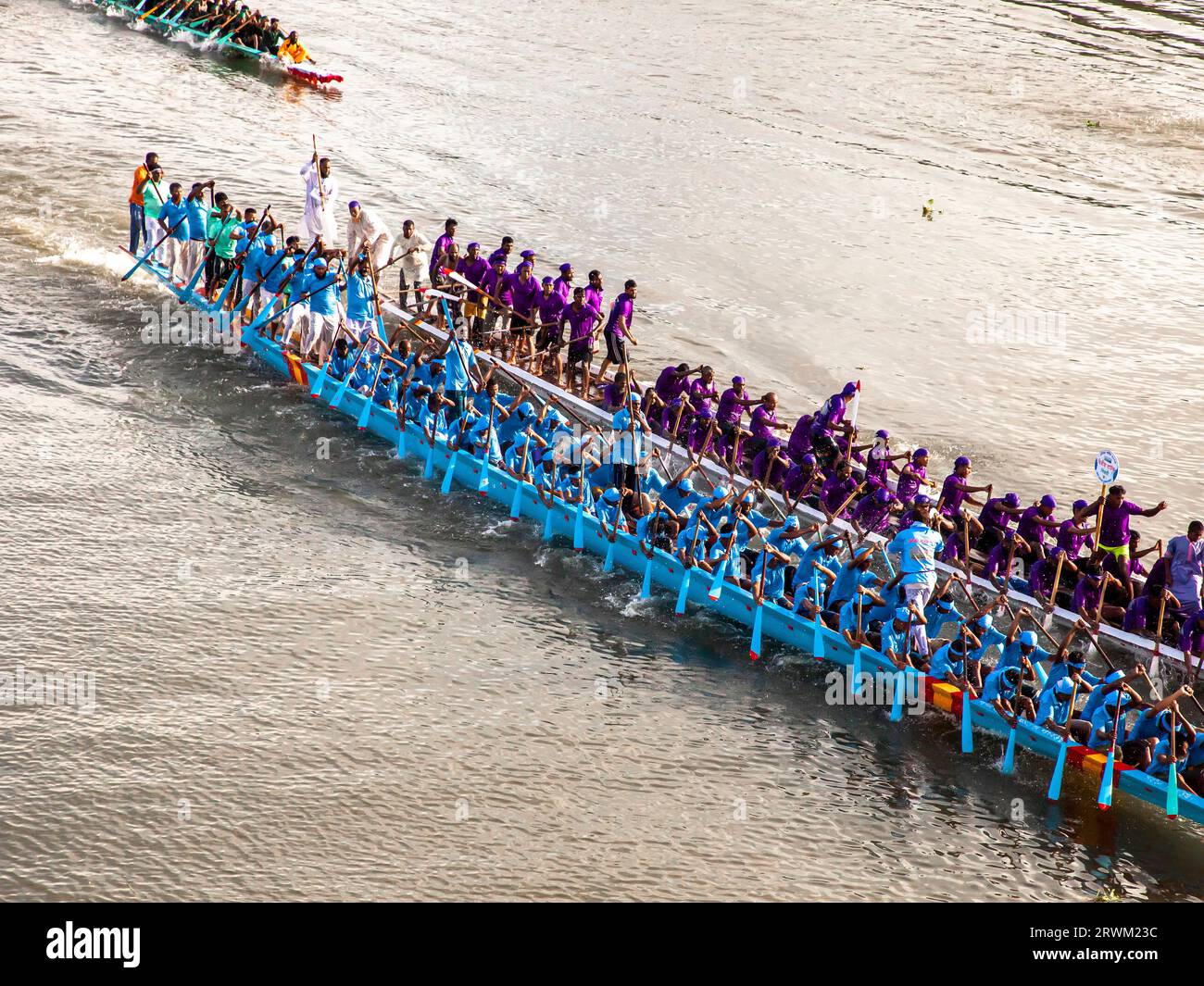 Nouka Baich is a traditional dragon boat-style paddling sport of Bangladesh. The boat race was held at the Titas River in Brahmanbaria with Thousands of people from the coastal area in attendance. A total of 14 boats from Brahmanbaria, Habiganj and Kishoreganj took part in the race. Brahmanbaria, Bangladesh. Stock Photo