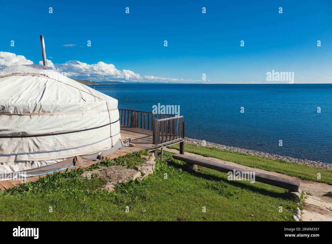 Traditional Mongolian portable round tent (ger) on wooden platform at ...