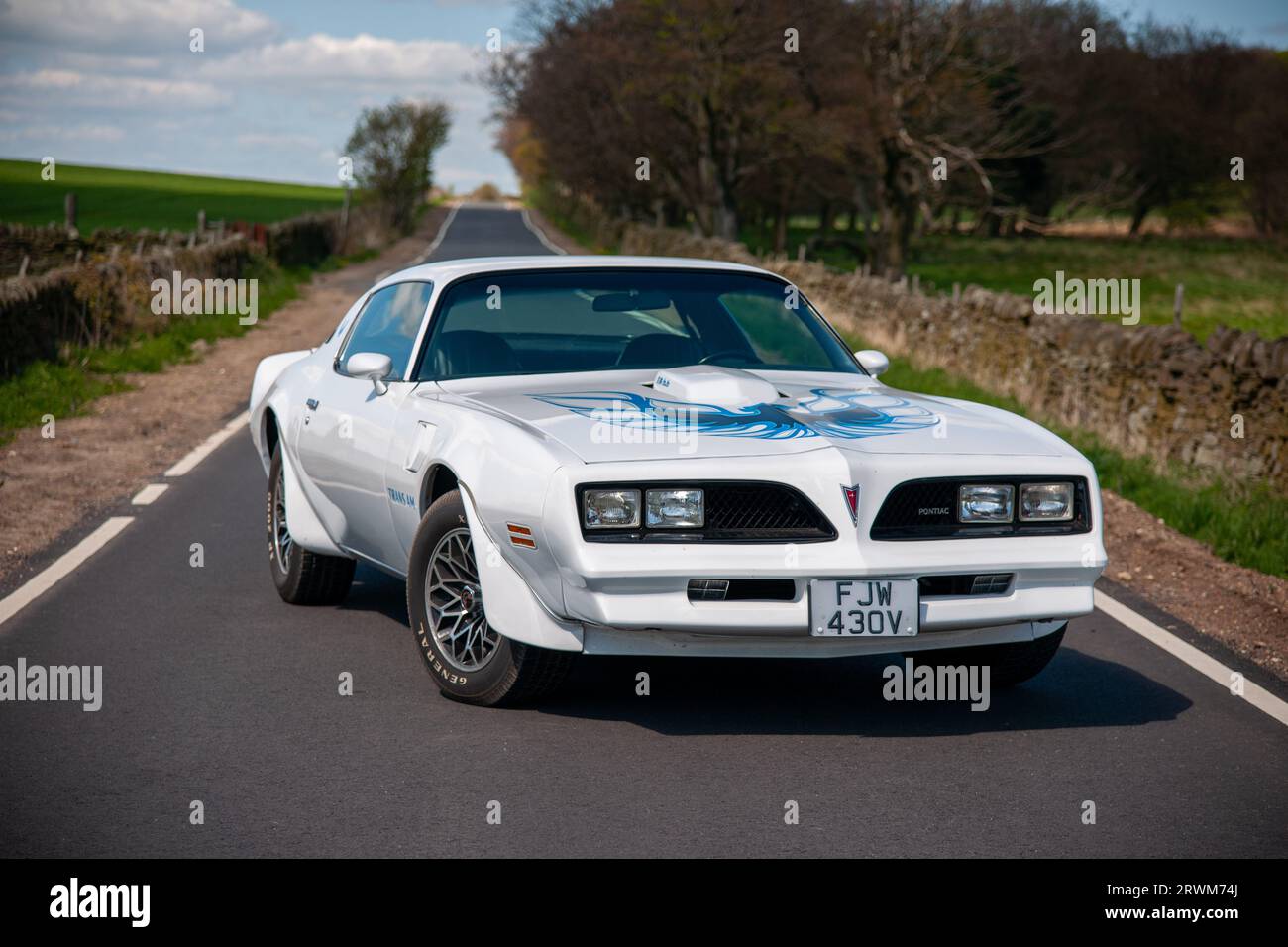 White Pontiac Firebird Trans-Am parked on a country lane in Yorkshire, England on a Winter's day Stock Photo