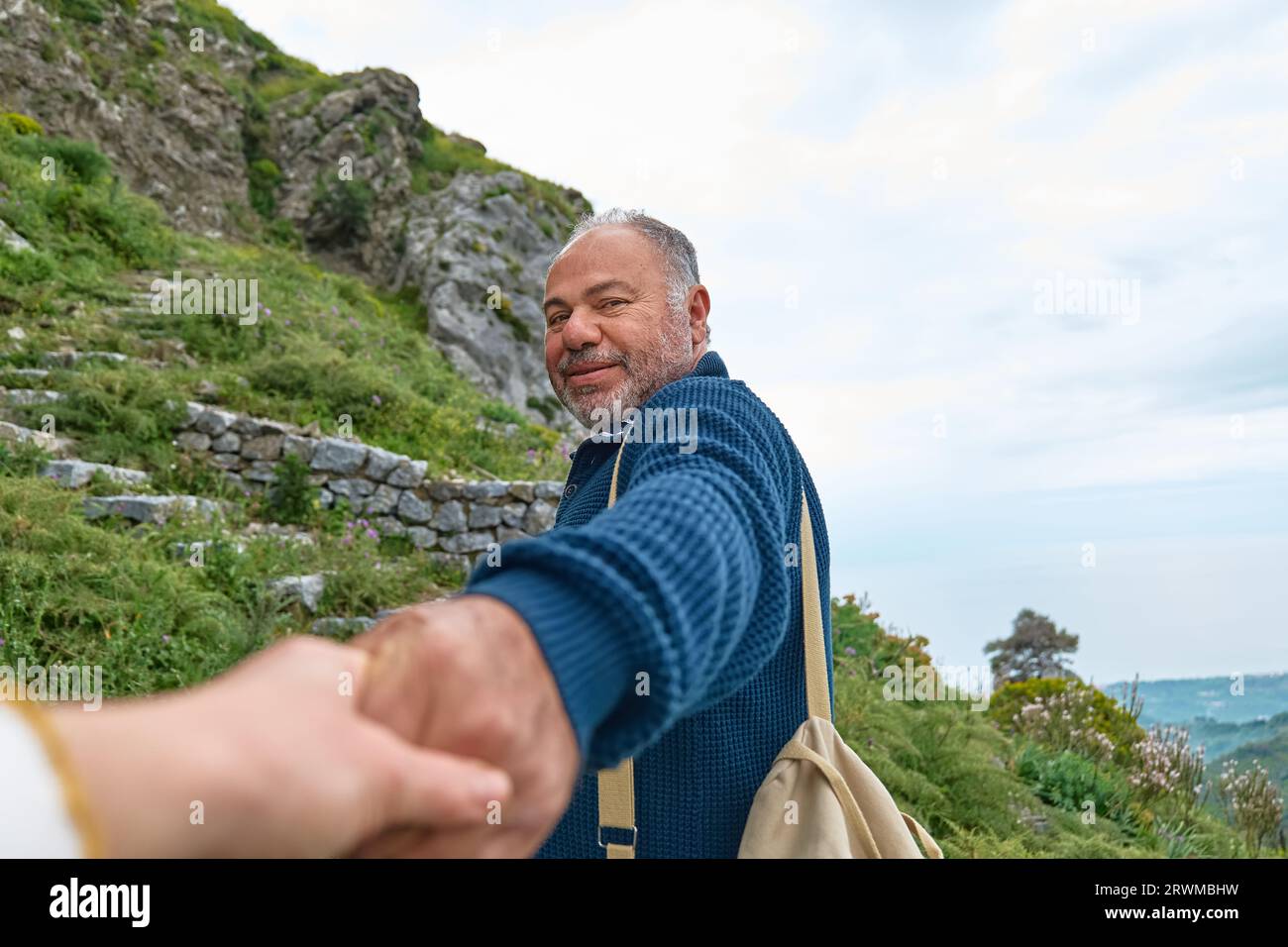 Follow me. Middle aged bearded man having trip in maintain. Stock Photo