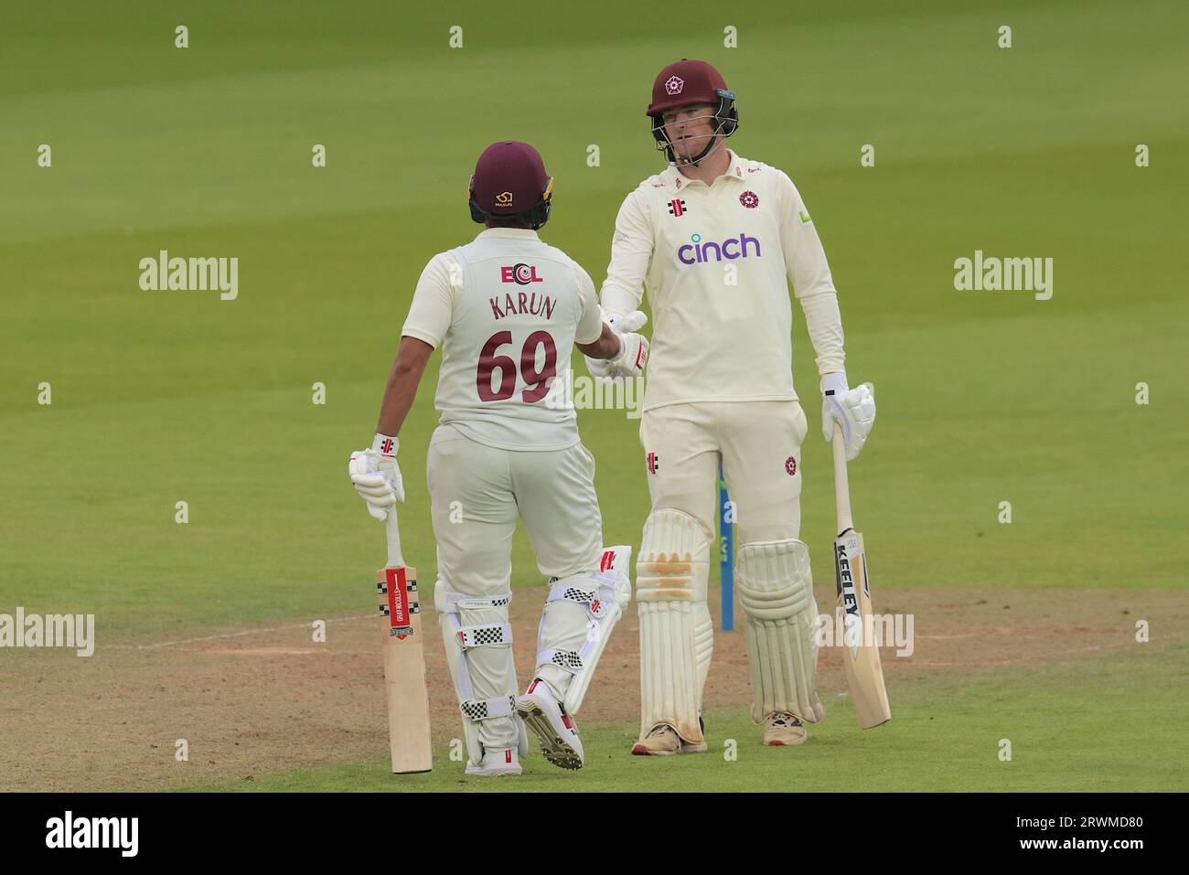 London, UK. 20th Sep, 2023. Northamptonshire's Karun Nair and Tom Taylor shake hands after reaching a partnership of 101 as Surrey take on Northamptonshire in the County Championship at the Kia Oval, day two. Credit: David Rowe/Alamy Live News Stock Photo