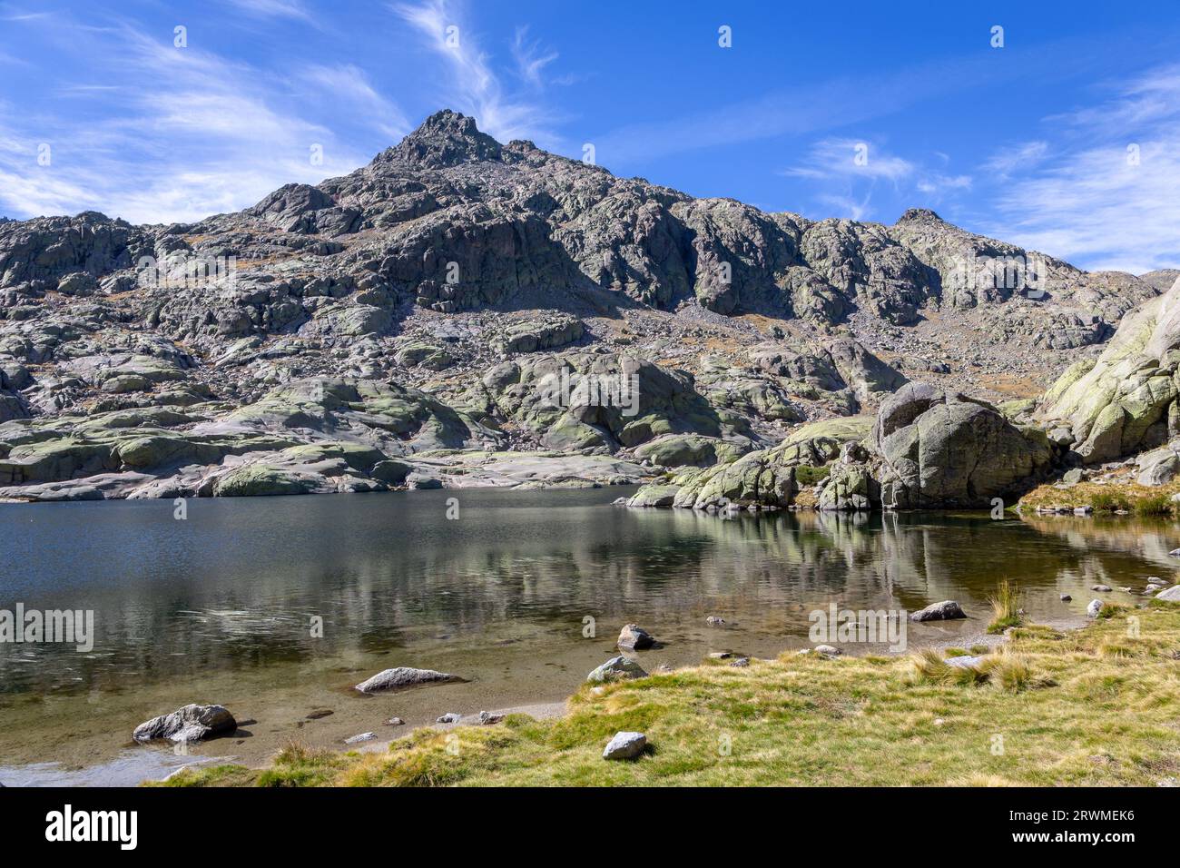 Laguna Grande de Gredos in Sierra de Gredos, landscape with high rocky mountains in the background, autumn view. Stock Photo
