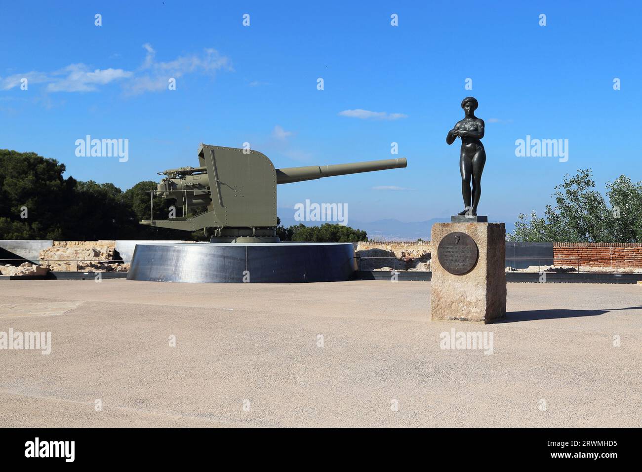 BARCELONA, SPAIN - MAY 11, 2017: This is a naval cannon on the bastion of San Carlos of the Montjuic castle and the  Gaspard de Portol's monument. Stock Photo