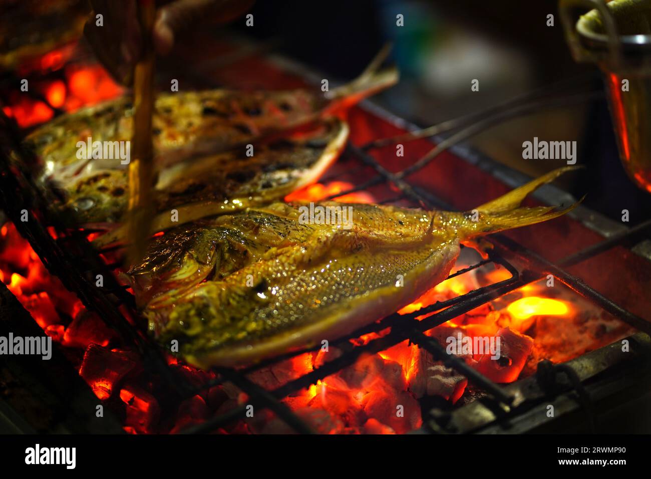 Traditional Indonesian grilled fish dish marinated in a blend of spices and herbs, then grilled over a big fire. The result is a flavorful and juicy f Stock Photo