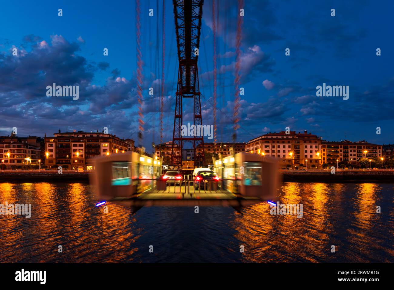 Frontal view of the Vizcaya Bridge in Portugalete, Spain at dusk. The Vizcaya Bridge is a transporter bridge and opened in 1893. Stock Photo