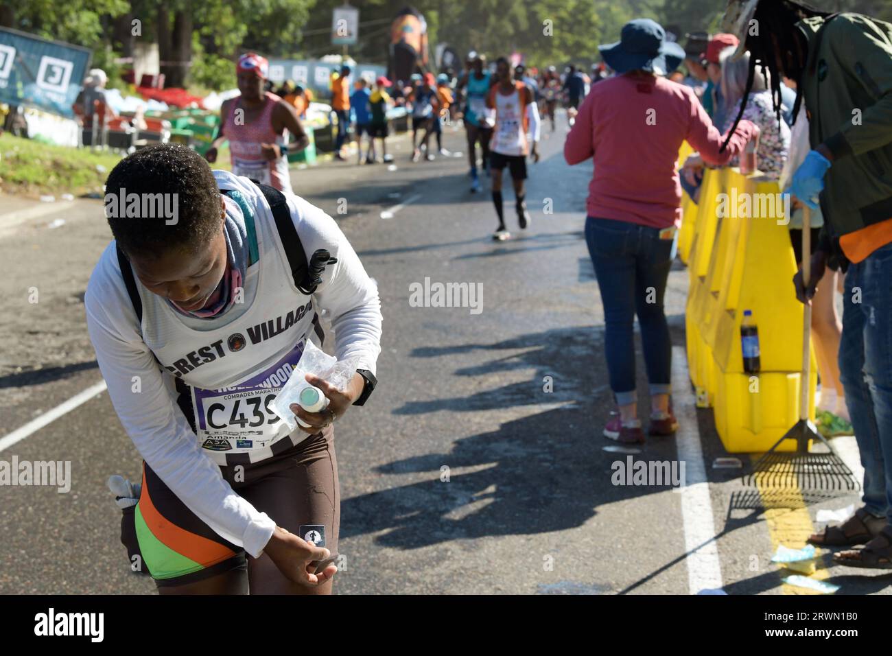 Endurance athletes, runners in 96th Comrades marathon 2023, iconic sport running event, Durban, KwaZulu-Natal, South Africa, long distance race scene Stock Photo