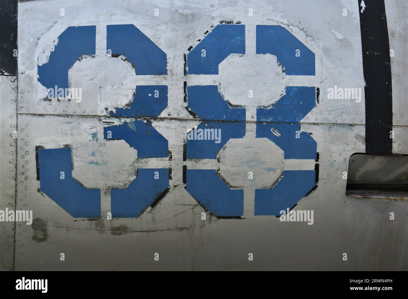 The number 38 on the fuselage of an old airplane. Number 38 written in ...
