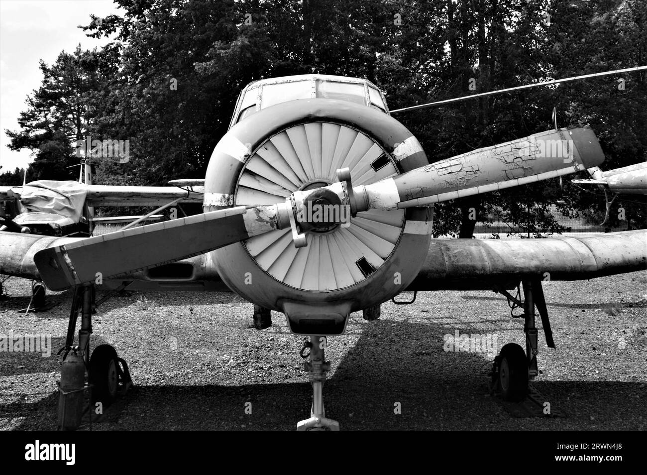 Front view of an old airplane. Aircraft propeller. Black and white