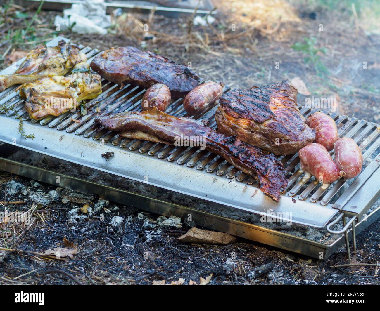 grilling chorizo sausages , chicken quarters, skirt steaks, flank
