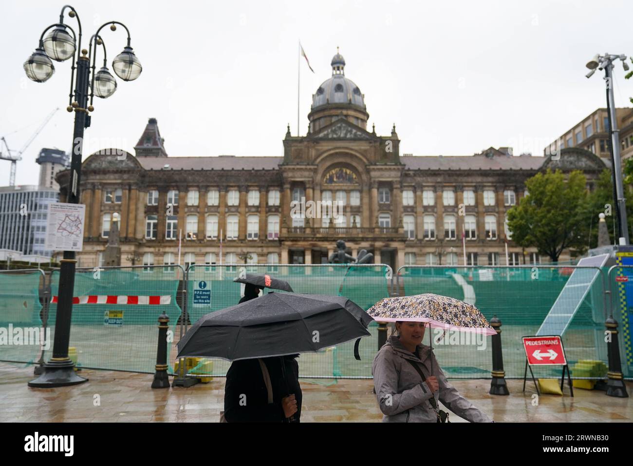 People walk by Victoria Square, Birmingham, after Communities Secretary Michael Gove outlined plans to appoint commissioners to take over Birmingham City Council and to launch an inquiry into the cash-strapped authority. Picture date: Wednesday September 20, 2023. Stock Photo