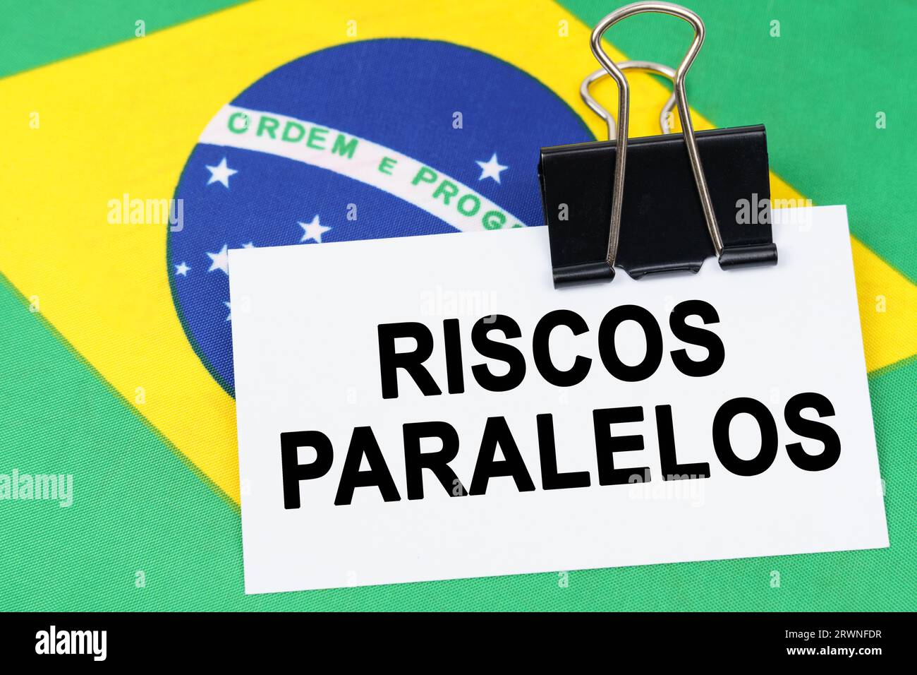 Economy and finance concept. On the flag of Brazil lies a business card ...