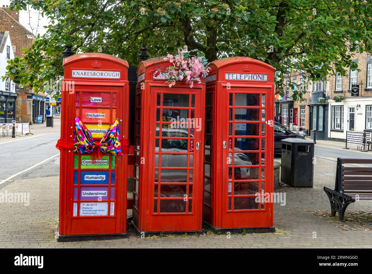 Three Telephone boxes part dressed for Pride 2023, Market Place, Knaresborough, North Yorkshire, England, UK Stock Photo