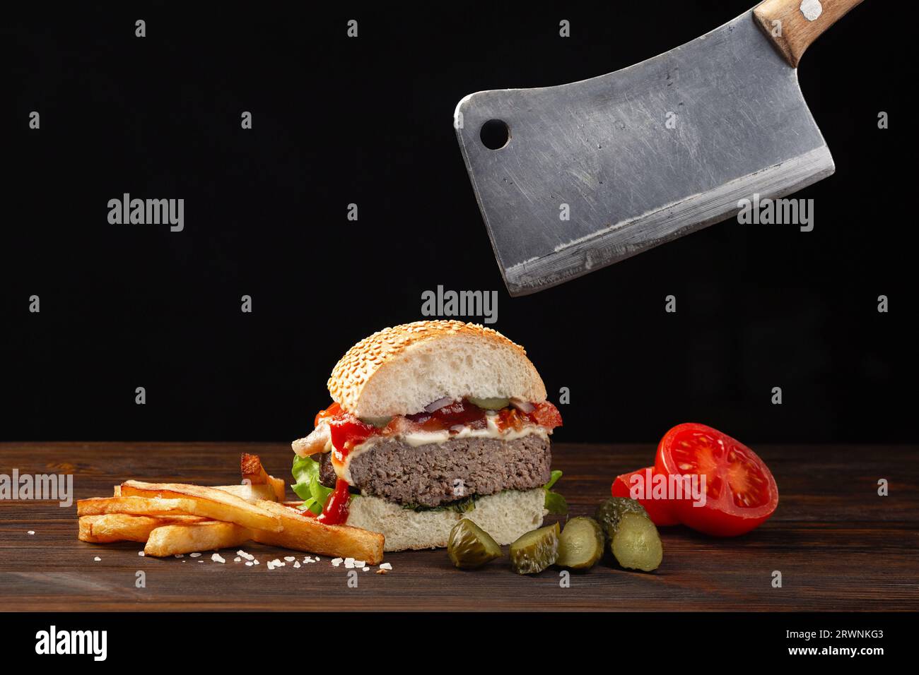 Homemade hamburger cut in half closeup with beef, tomato, lettuce