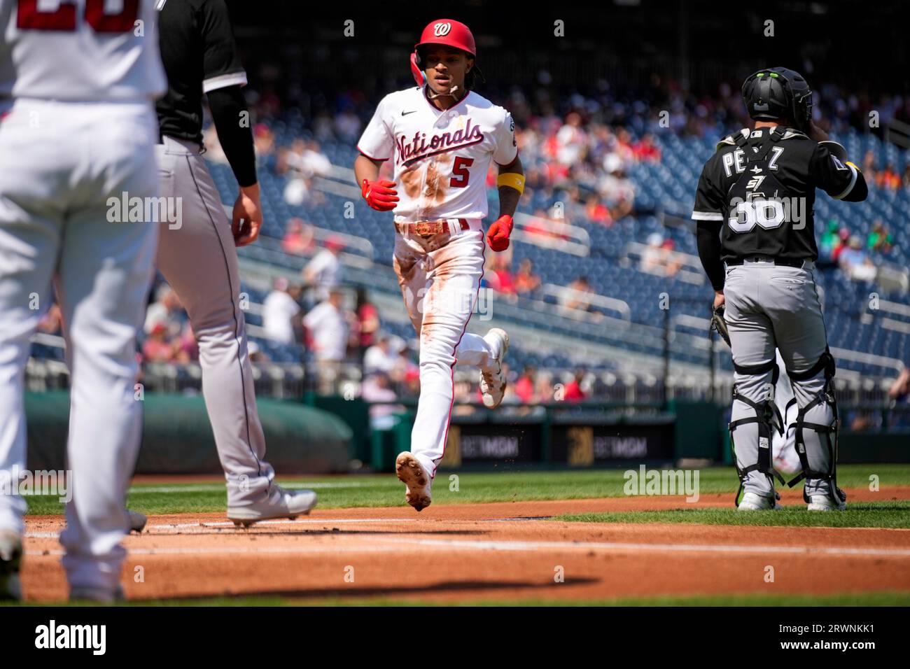 Washington Nationals shortstop CJ Abrams (5) looks to throw to first base  during a baseball game against the Detroit Tigers at Nationals Park,  Friday, May 19, 2023, in Washington. (AP Photo/Alex Brandon