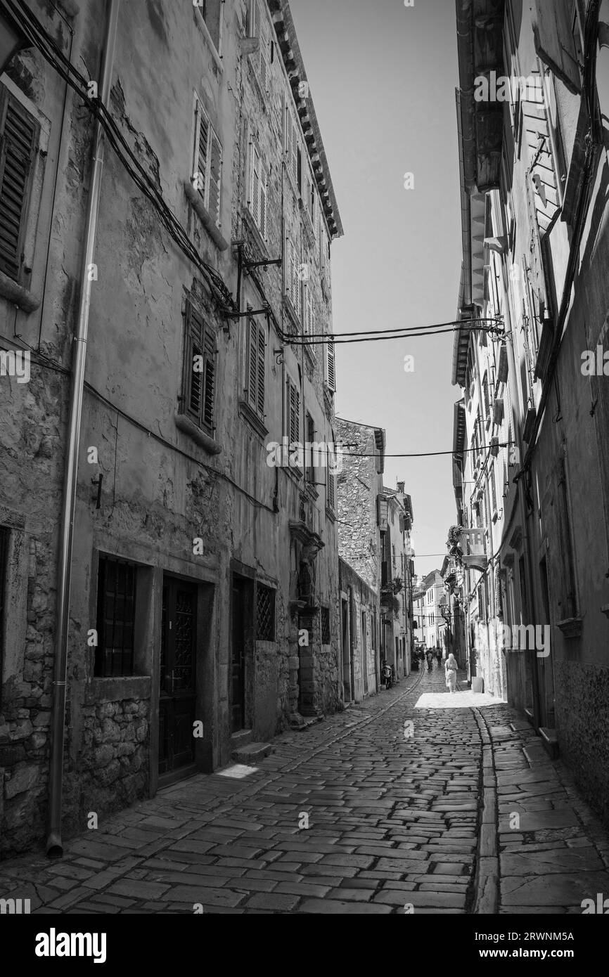 Old town buildings balcony shutters Black and White Stock Photos
