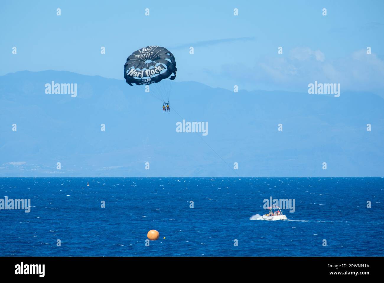 Tourists Parasailing with speedboat in Costa Adeje, Tenerife, Canary Islands Stock Photo