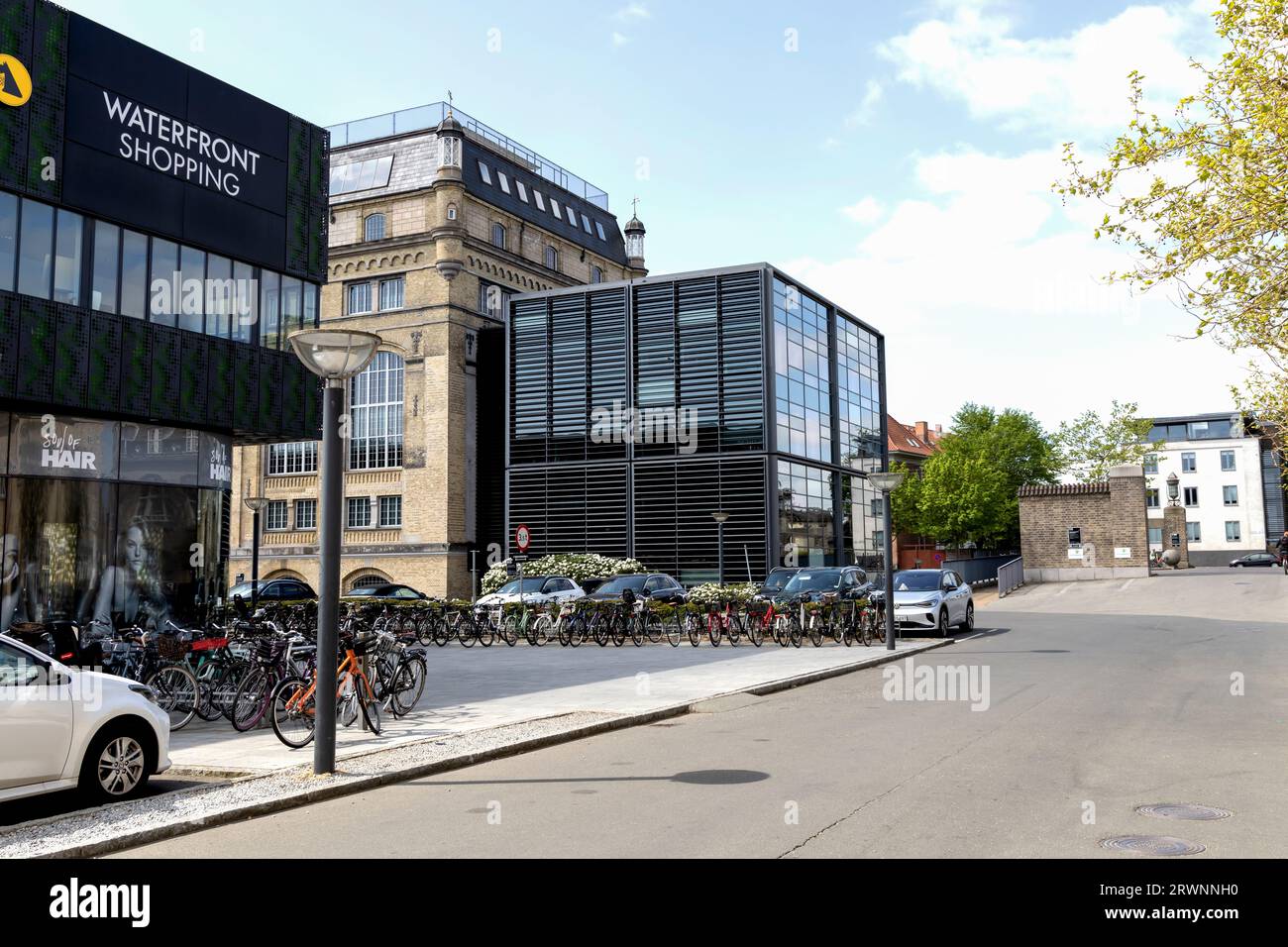 Copenhagen city street with cars and bicycles. Street repair work. Real