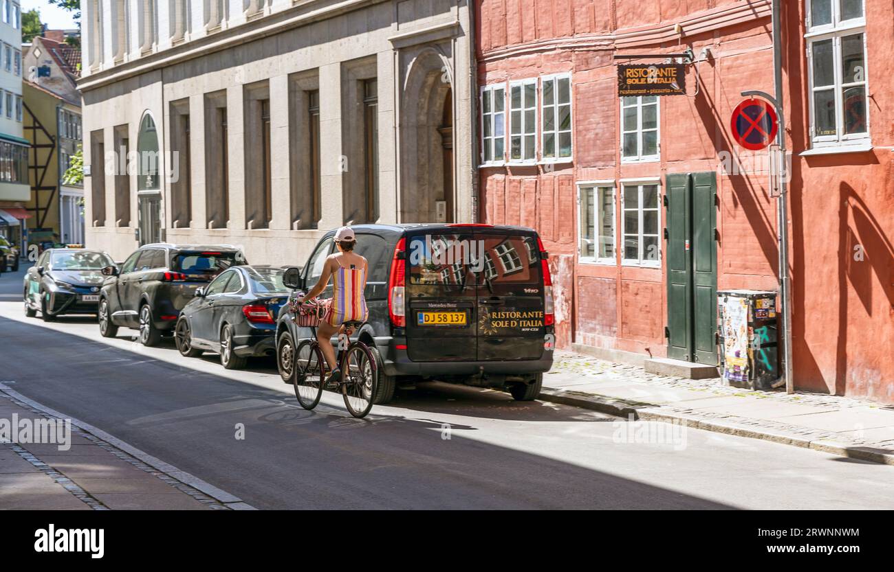 Copenhagen city street with cars and bicycles. Street repair work. Real