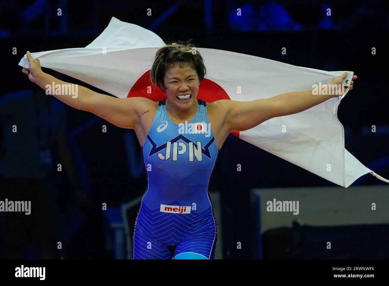 Yuka Kagami of Japan celebrates defeating Kyrgyzstani Aiperi Medet Kyzy and winning the women