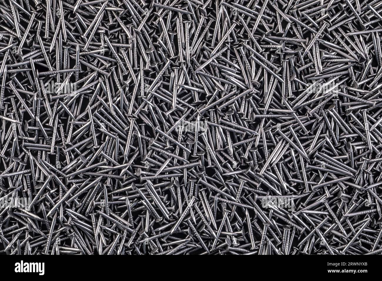 Lots of shiny metal nails background Stock Photo